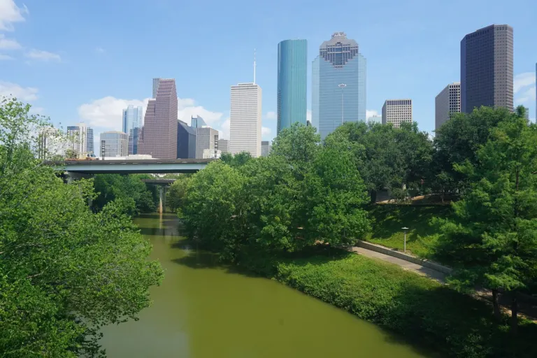 Buffalo Bayou Park's trails and green space with the downtown Houston skyline behind